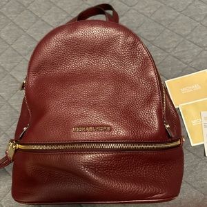Michael  by Michael Kors maroon leather backpack, lightly used with all tags.